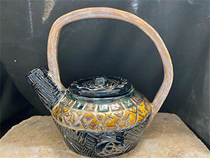 Image of Emily Nusbaum's ceramic teapot, "The Olde Gods." 